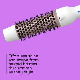 Close-up of ceramic barrel for even heat distribution and frizz control.