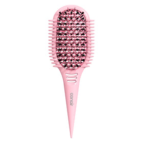 Conair Curl Define Pro brush on wet hair, smoothing tight curls with ease.