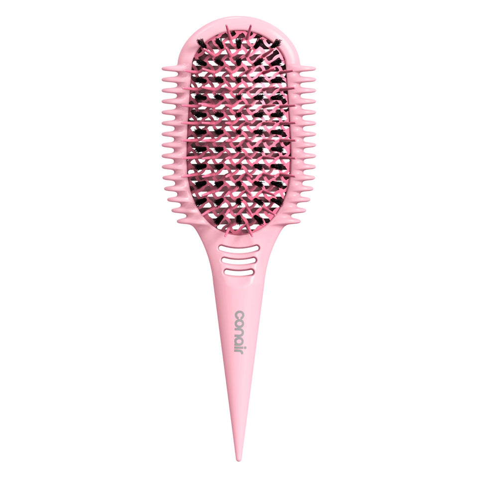 Conair Curl Define Pro brush on wet hair, smoothing tight curls with ease.