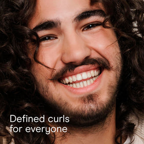 Conair Curl Define Pro detangler brush highlighting dual-vent design for quick drying.