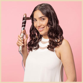 Conair INFINITIPRO Frizz Free curling iron heats up in 15 seconds for quicker styling.