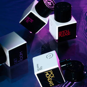 Lifestyle shot of Confessions of a Rebel Fck Mondays EDP in a purse for outings.