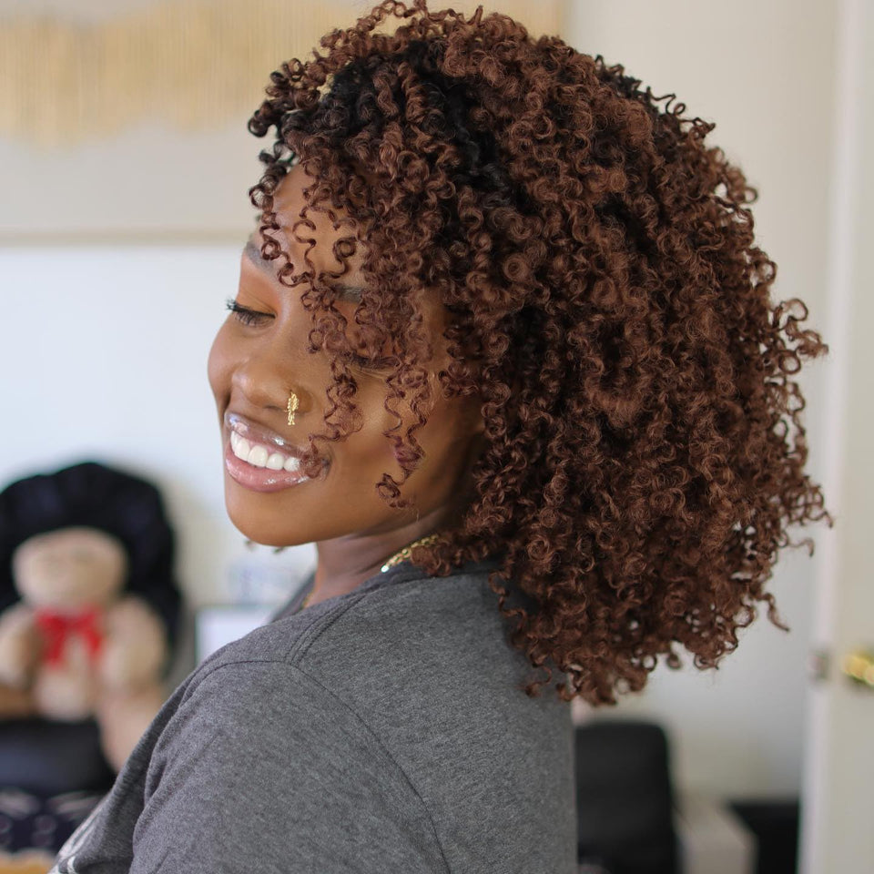 COOKOO Yanky Twist crochet braids in Ombre 1B/30 for a natural look.