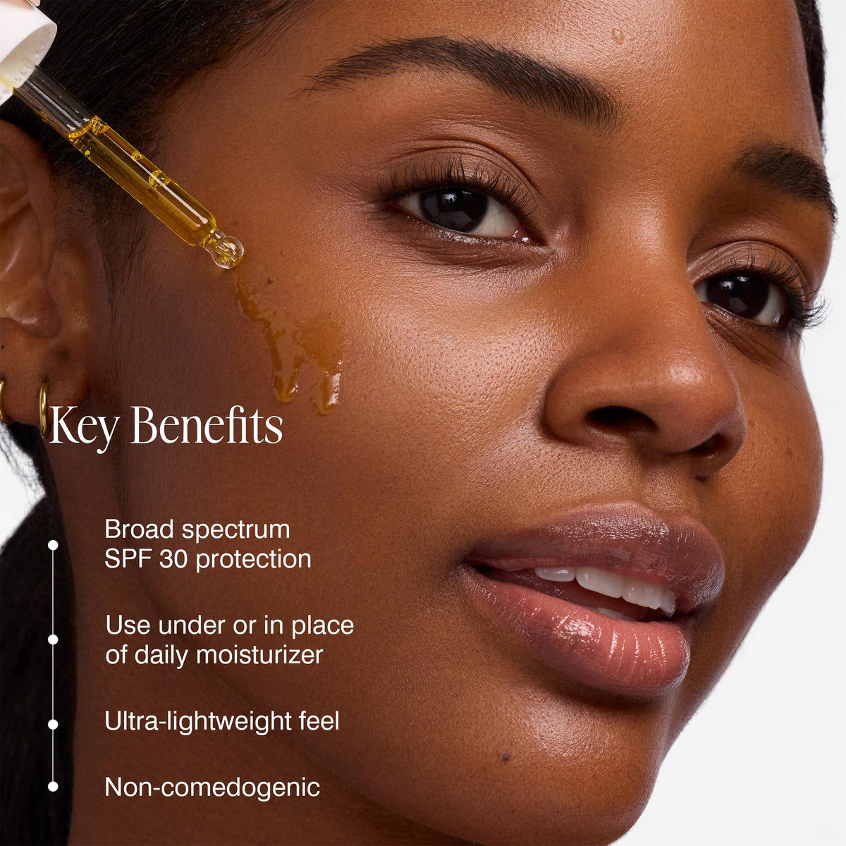 COOLA Firming Face Oil SPF 30 being applied for daily protection