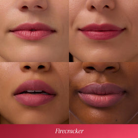 COOLA tinted lip balm applied on lips for moisture and color.