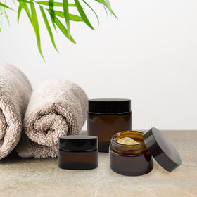 Cornucopia Brands 2oz amber glass jar with straight sides, perfect for sample creams.