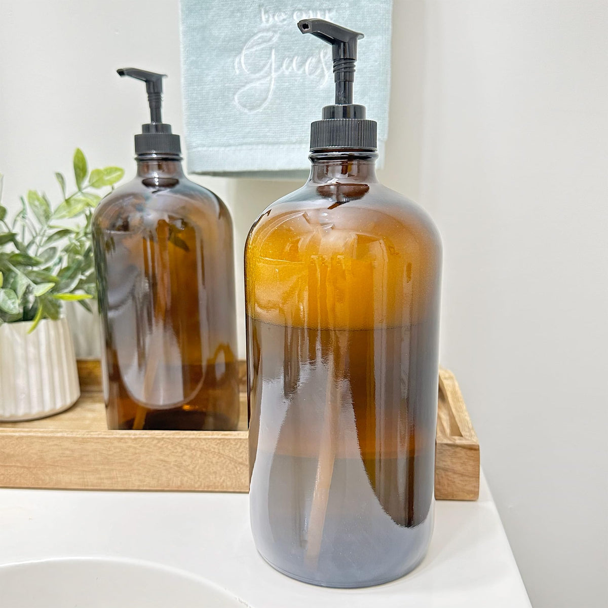 Close-up of amber glass bottle pump top preserves ingredients and maintains consistency.