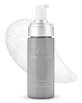 COSMEDIX Clarify bottle pour showing a gentle, skin-friendly cleanse