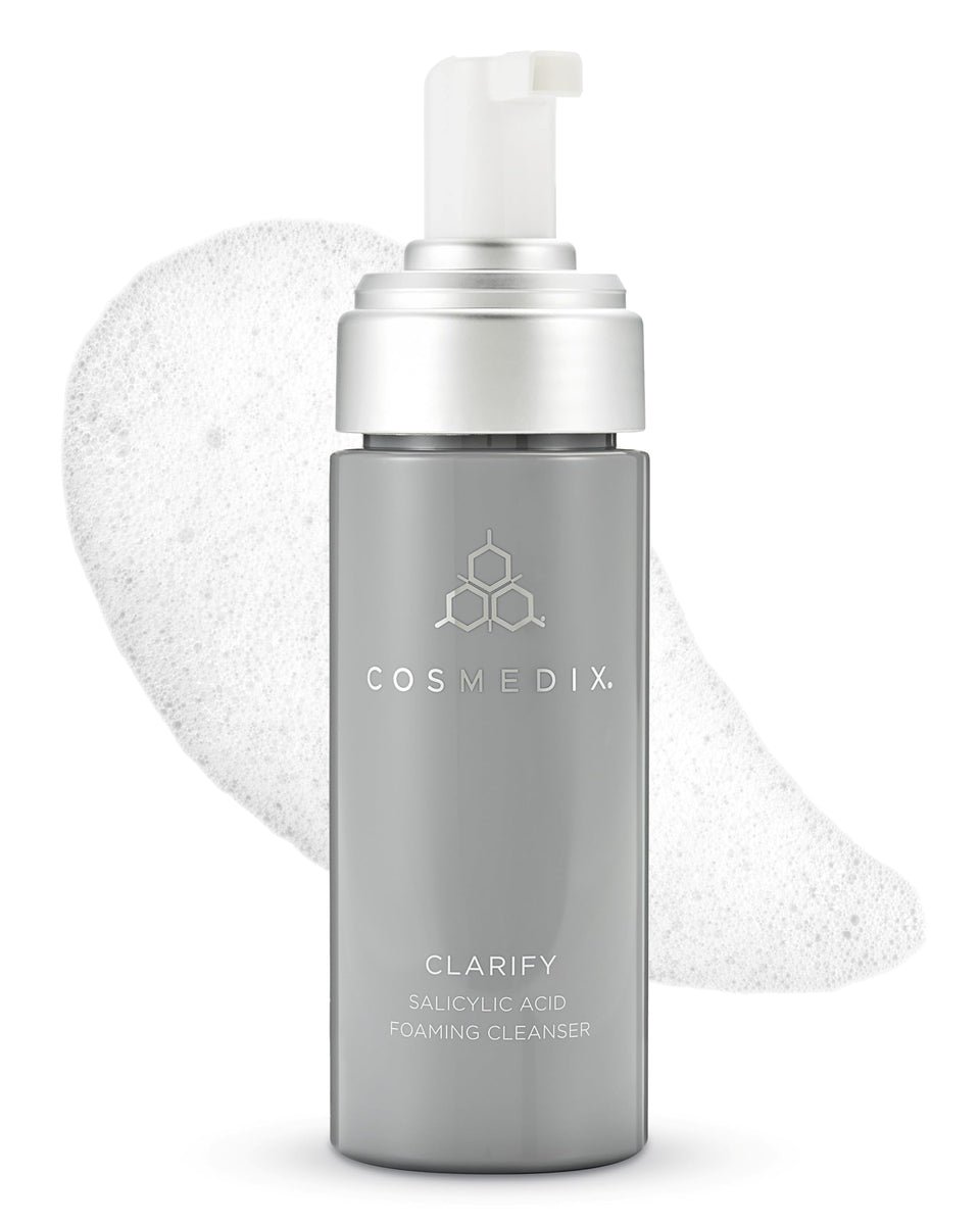 COSMEDIX Clarify bottle pour showing a gentle, skin-friendly cleanse