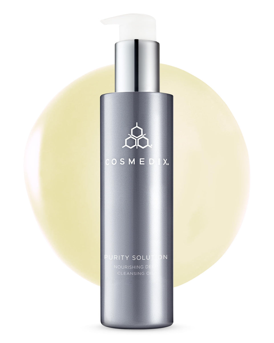 CosMedix Purity Solution cleansing oil bottle pour for makeup removal and hydration.