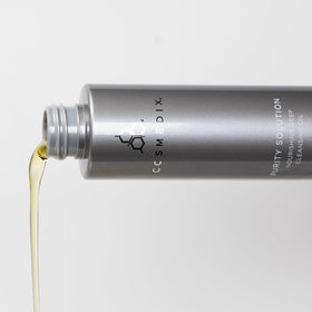 CosMedix Purity Solution cleansing oil packaging shot with brand branding.
