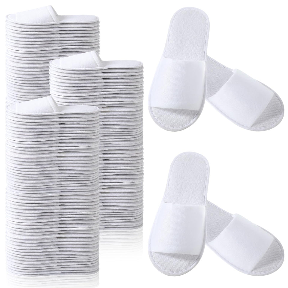 Coume disposable slippers open-toe white for guest comfort in hotels and homes.
