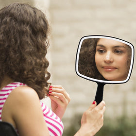 Covzoe portable mirror fitting into a compact travel bag for easy trips