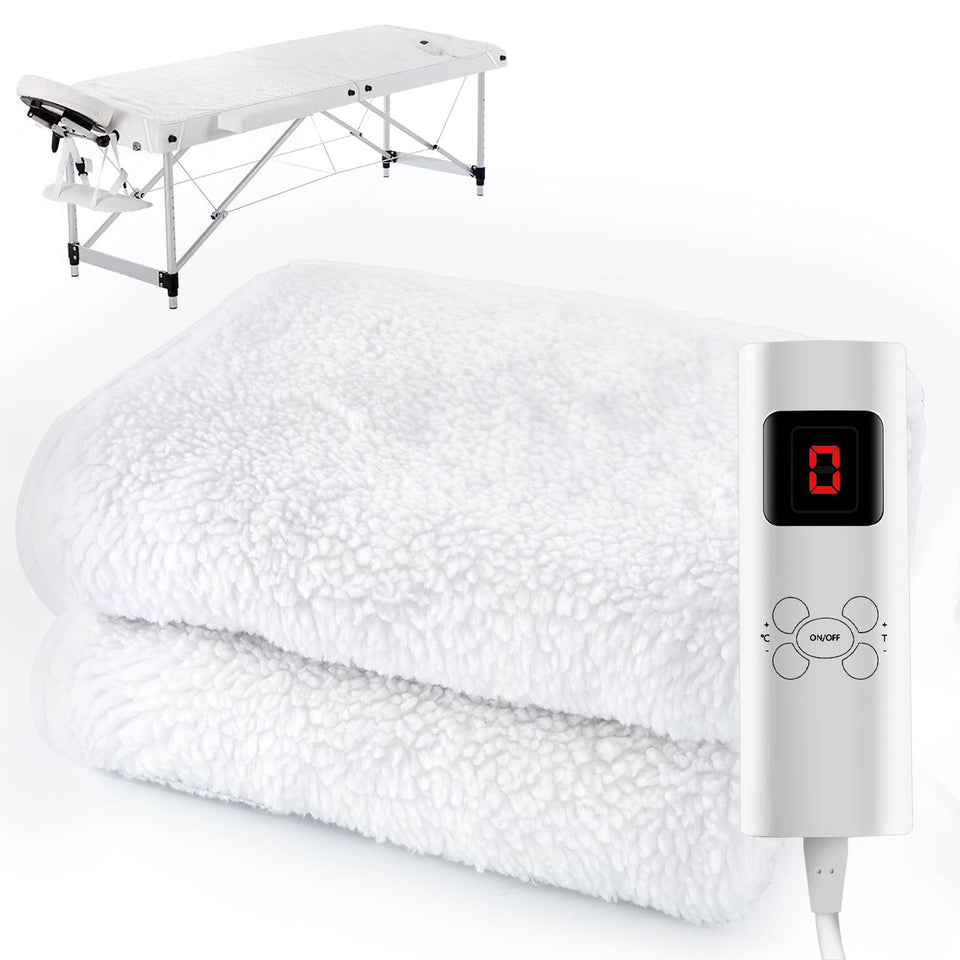 Crablux massage table heating pad on bed delivers cozy warmth for sessions.