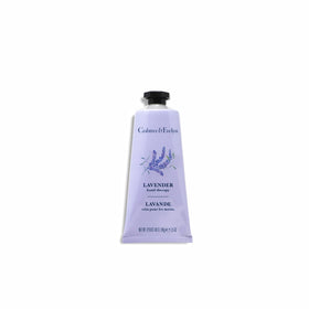 Crabtree & Evelyn Lavender Hand Therapy with lavender blooms beside the jar, ideal travel companion.