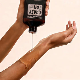 Crazytan on beach day setup for hydrated, natural-looking tan