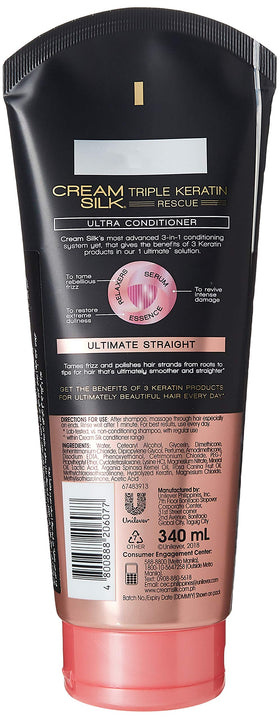 Cream Silk Triple Keratin Rescue Ultimate Straight conditioner applied to hair for smooth, manageable results.