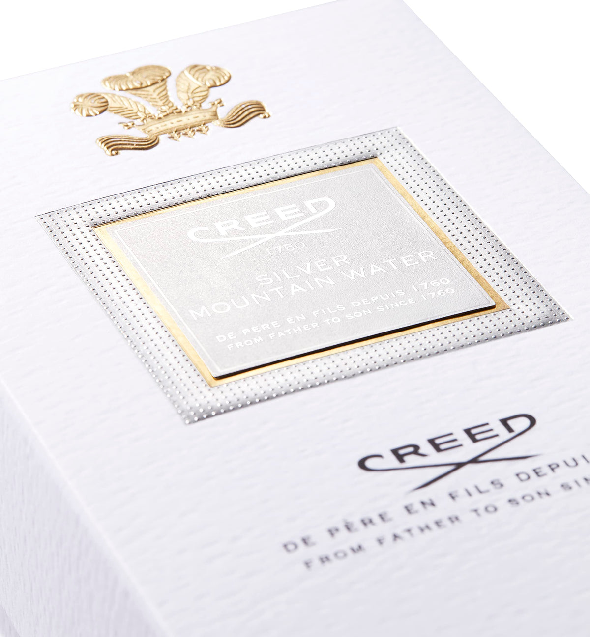 Creed Silver Mountain Water cap closeup emphasizes craftsmanship and elegance.