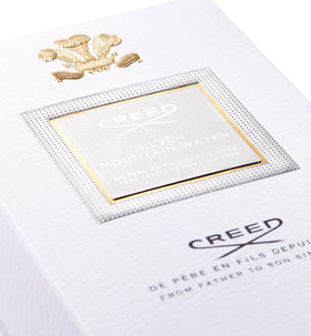 Creed Silver Mountain Water cap closeup emphasizes craftsmanship and elegance.