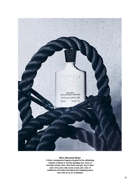 Creed Silver Mountain Water travel-ready bottle pictured beside grooming essentials.