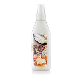 Creme of Nature Double Duty Curl Definer spray on hair demonstrates quick refresh and soft hold.