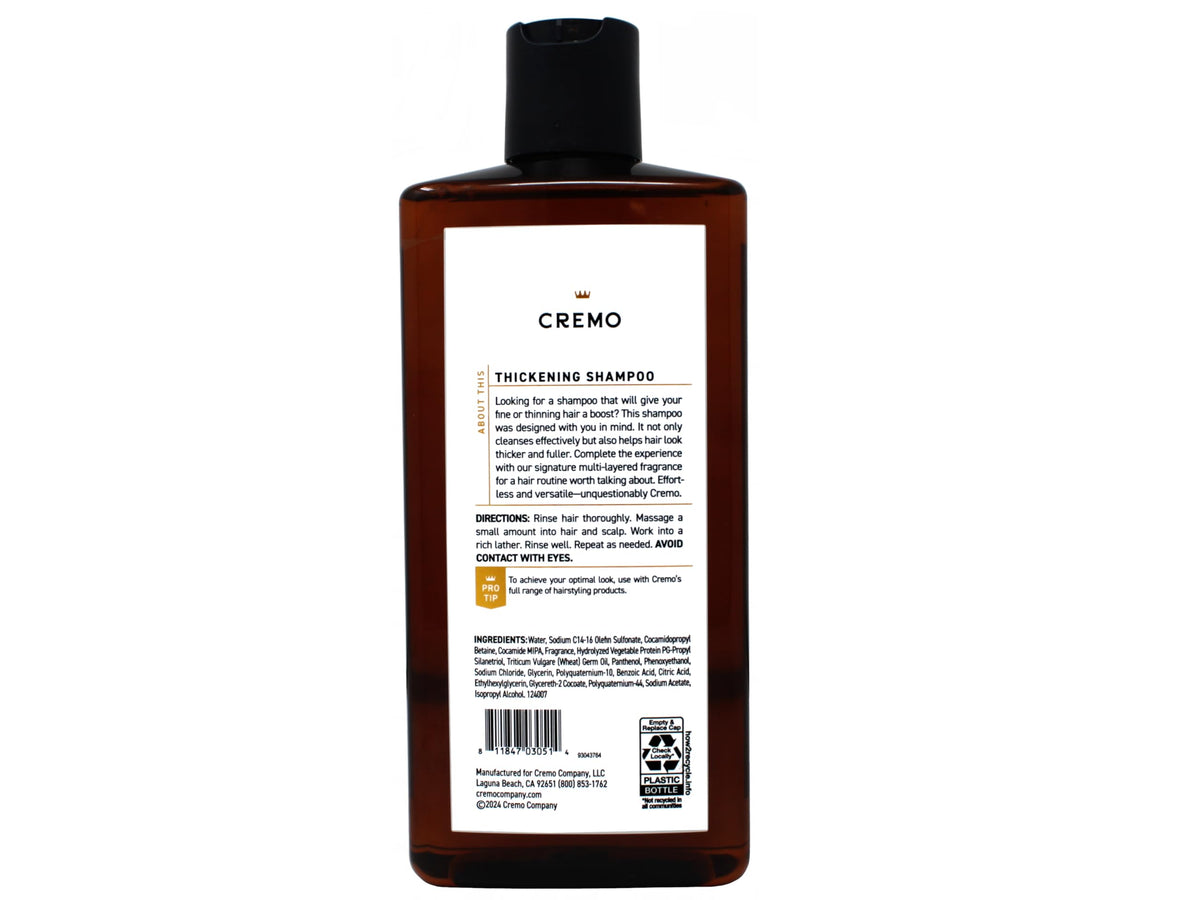 Cremo barber-grade bottle on shower shelf ready for daily volume boost.
