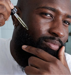 Cremo Distiller's Blend application dropper ready to soothe beard itch.