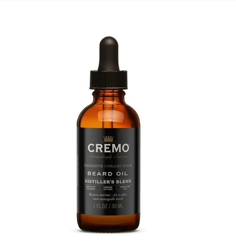Cremo Distiller's Blend beard oil bottle hydrates and softens facial hair.