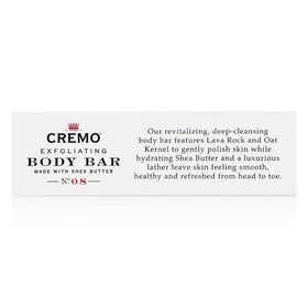 Cremo Bourbon and Oak exfoliating bar features shea butter for hydrated skin after use.