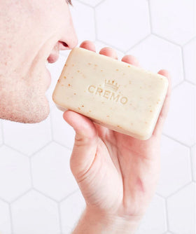 Cremo Bourbon and Oak exfoliating bar uses oat kernel for gentle exfoliation.