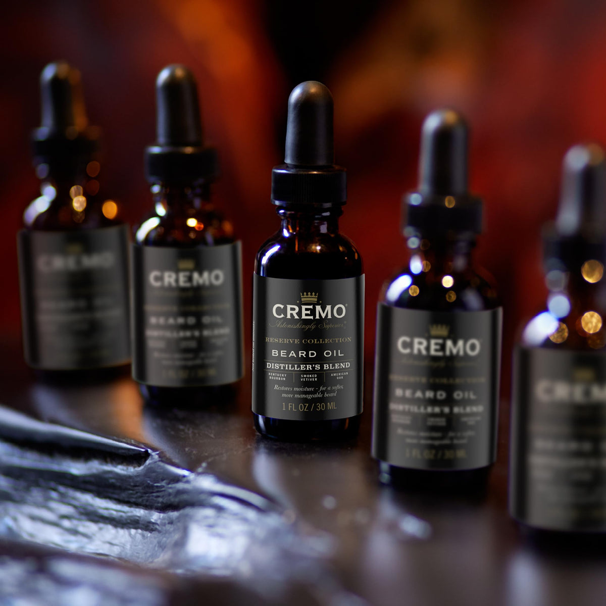 Cremo Reserve packaging variations shown for Distiller's Blend beard oil.