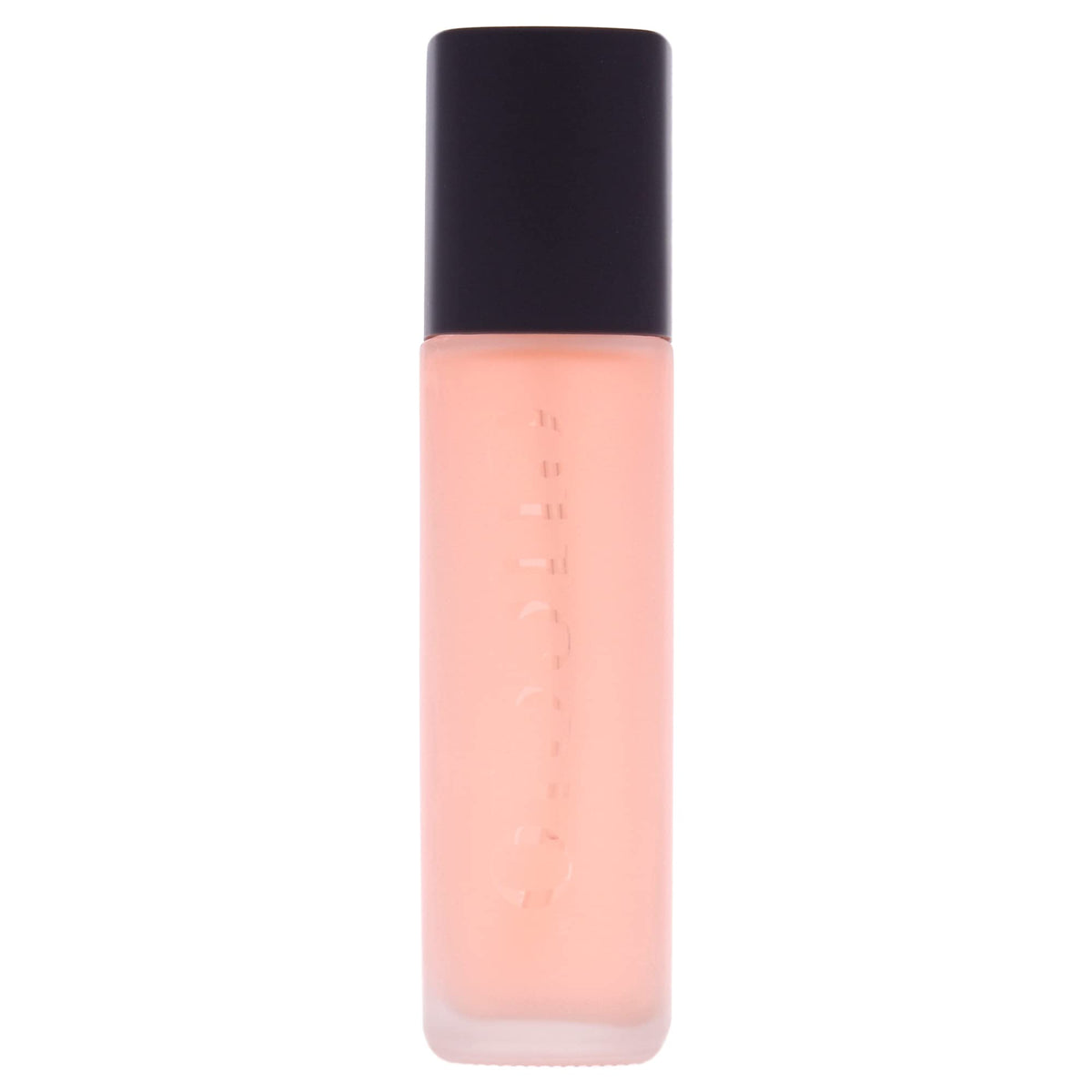 Cuccio Naturale Revitalizing Dry Body Oil being poured to reveal quick absorption.