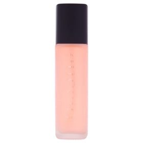 Cuccio Naturale Revitalizing Dry Body Oil being poured to reveal quick absorption.