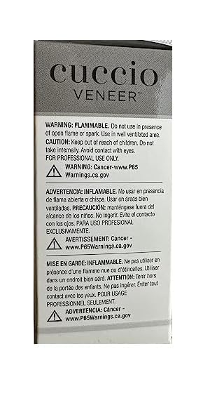 Cuccio Veneer curing under LED/UV lamp for efficient gel hardening.