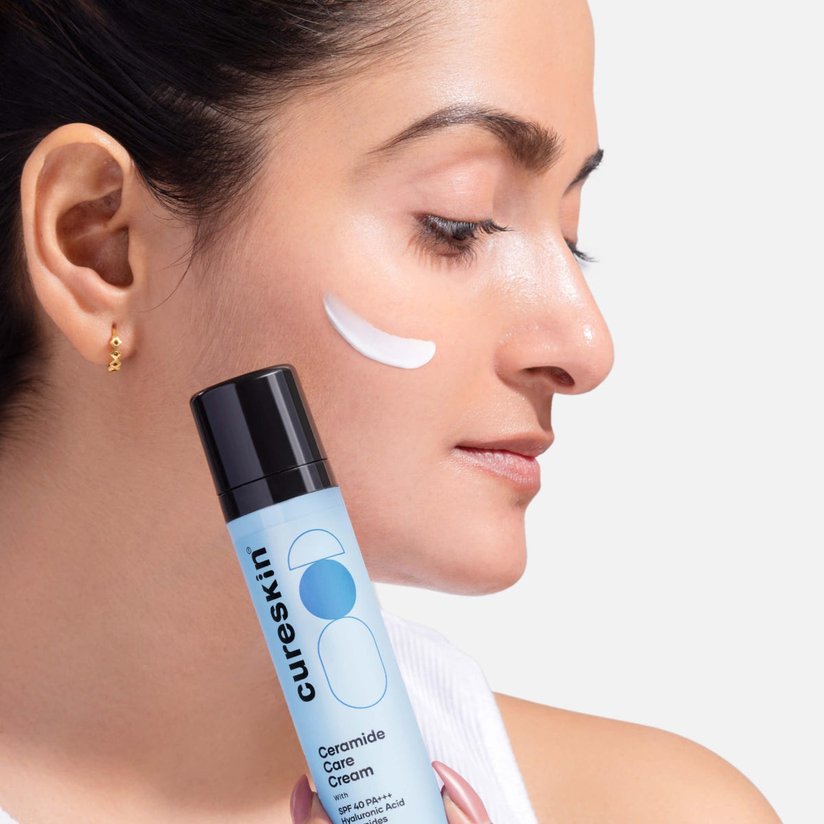 Cureskin ceramide moisturizer bottle texture close-up highlights lightweight feel.