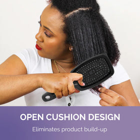 Open cushion design on Curl Keeper Flexy Brush in purple for shower use.