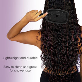 Curl Keeper Flexy Brush in purple used on wigs and extensions for detangling.