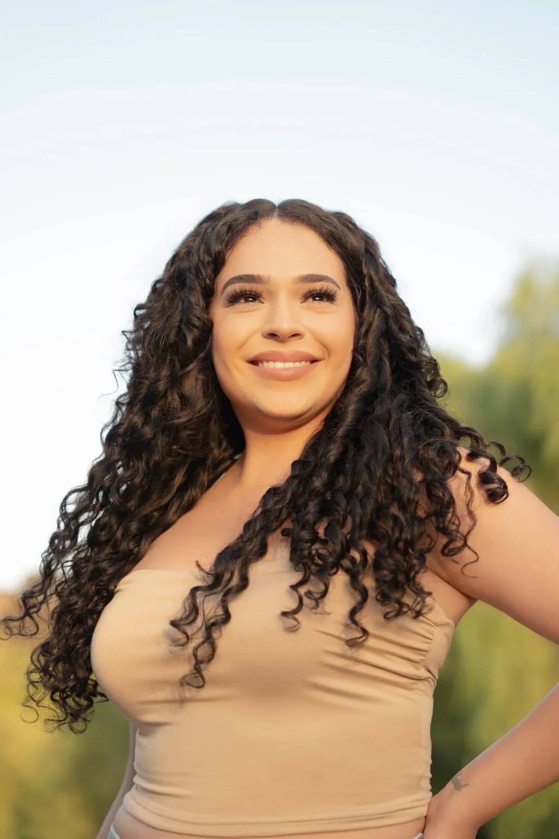 CurlFession Curl Cream beside styled waves for daylong bounce