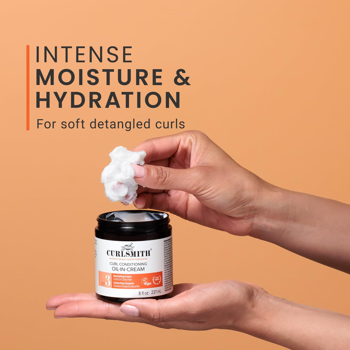 CURLSMITH Curl Conditioning Oil-in-Cream being dispensed for quick absorption.