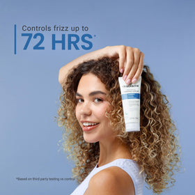 CurlSmith Frizz Rescue finishing serum application on hands, quick-dry glide for smooth hydrated curls