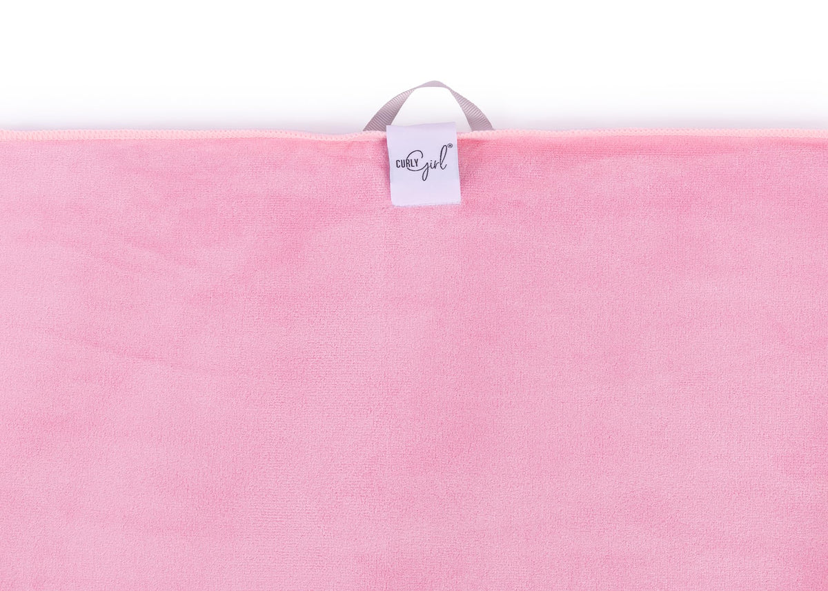 Curly Girl towel wraps curls gently for easy styling and reduced frizz.