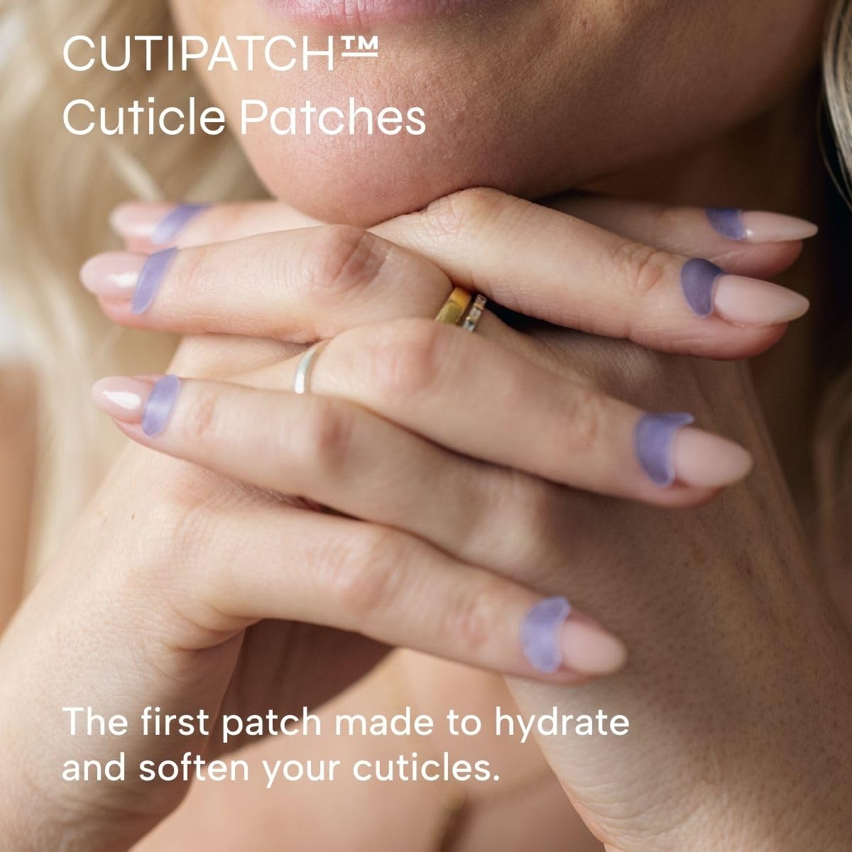 Applying CUTIPATCH patches to clean cuticles for smoother, moisturized skin.