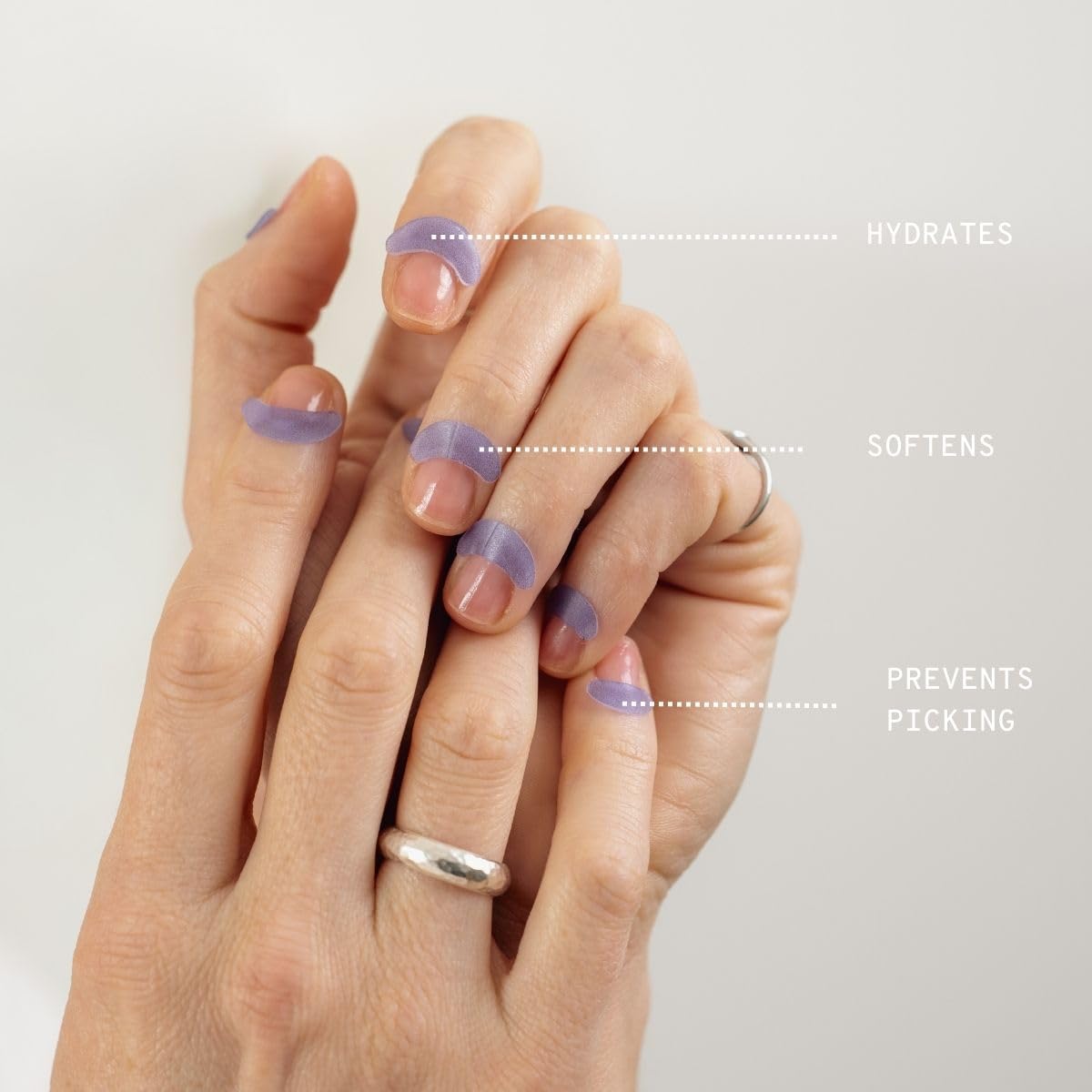 Close-up of CUTIPATCH patches on cuticles showing secure adhesion.