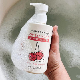 Kids in bath time image with Cherry on Top conditioner