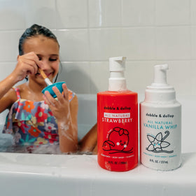 Children enjoying bath with Dabble & Dollop 3-in-1 wash, shampoo, and bubble bath.
