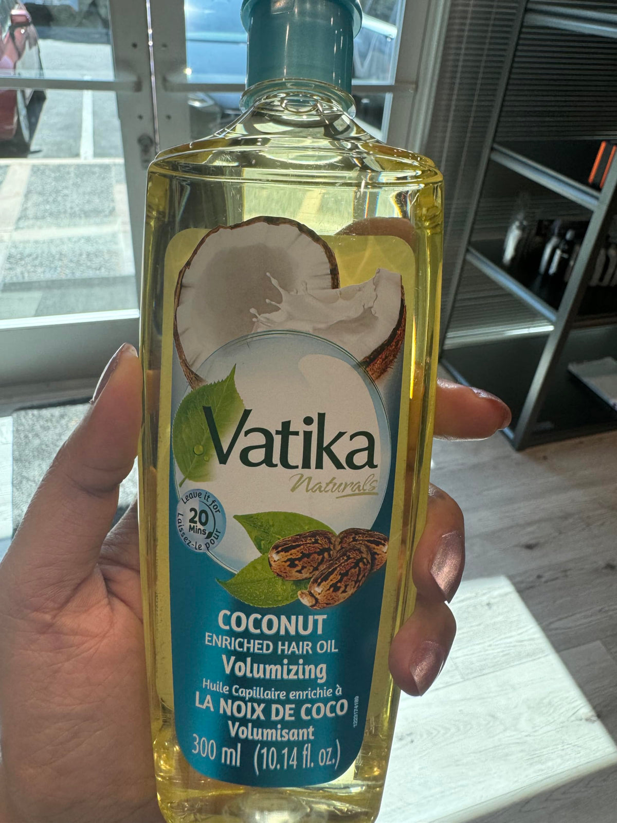 Dabur Vatika Naturals oil poured for deep hydration