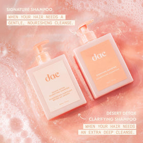 DAE Signature Shampoo flat lay with botanicals and bottle