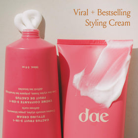 DAE Spellbound styling cream mini applied to smooth and define curls.
