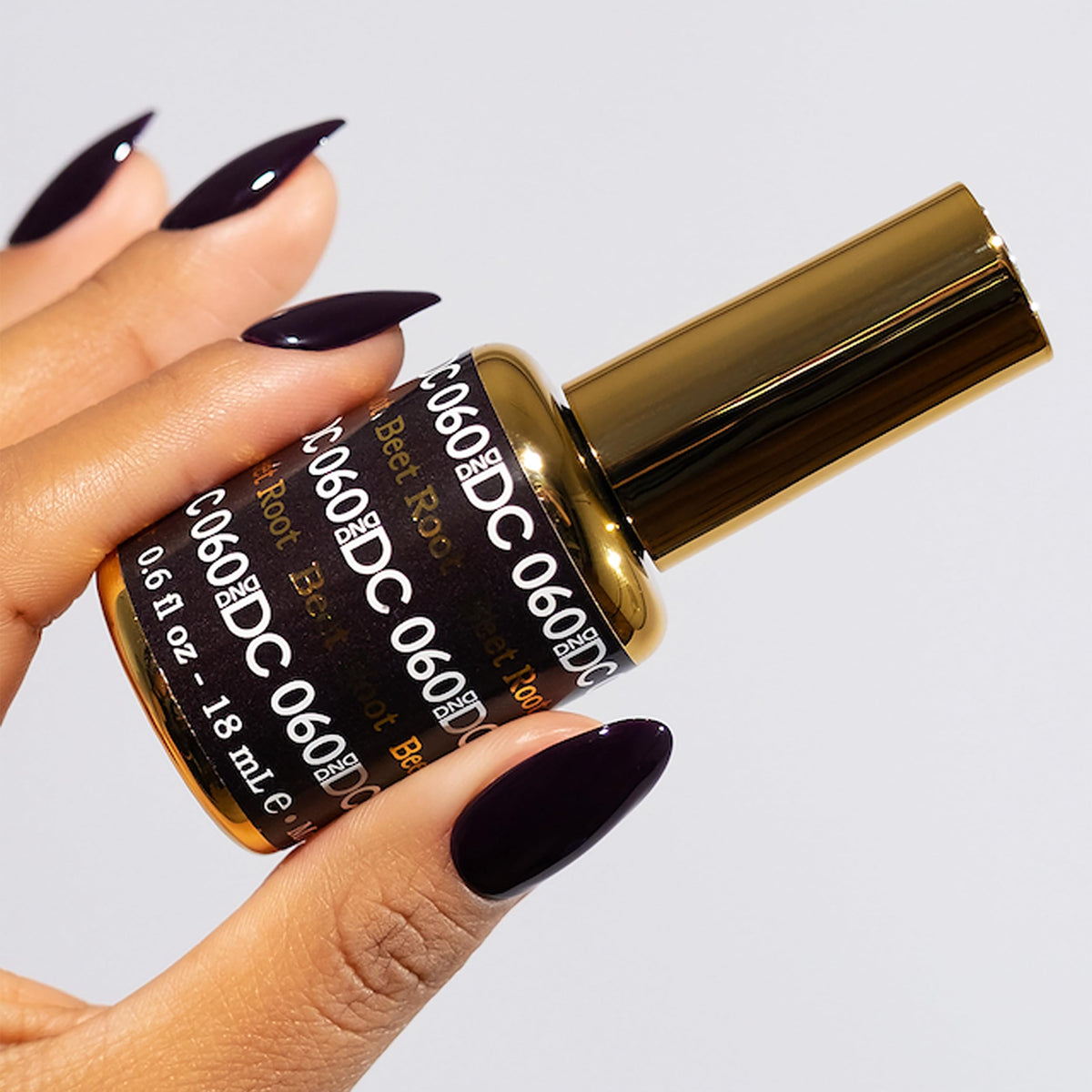Daisy DND Beet Root 060 gel polish on nails showing long wear