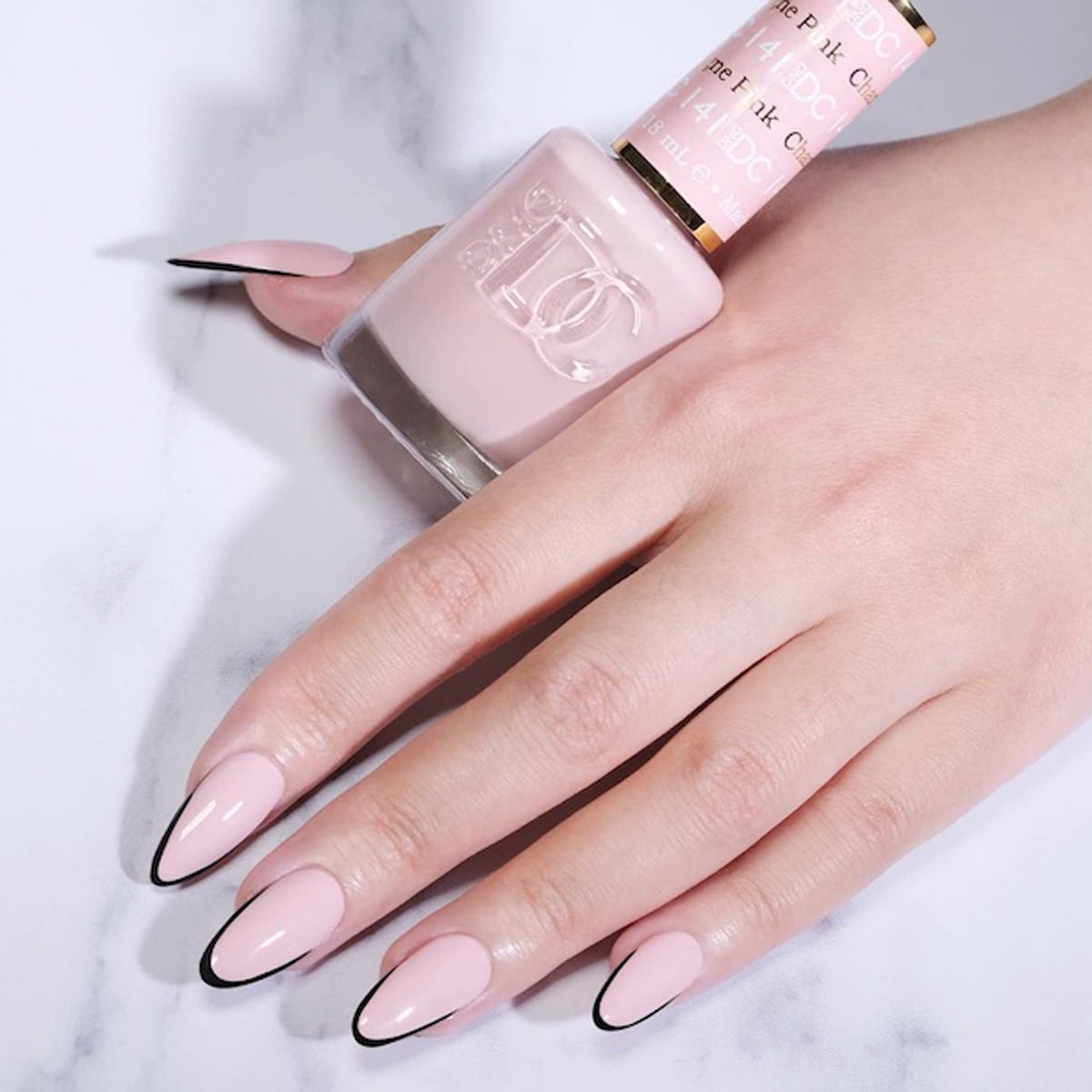 DAISY DND Pink Champagne swatch on nail for color reference and inspiration.